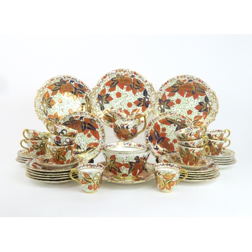 187 - A LATE 19TH CENTURY COPELAND TEA SERVICEin pattern 1559, decorated in the imari palette with leaves ... 