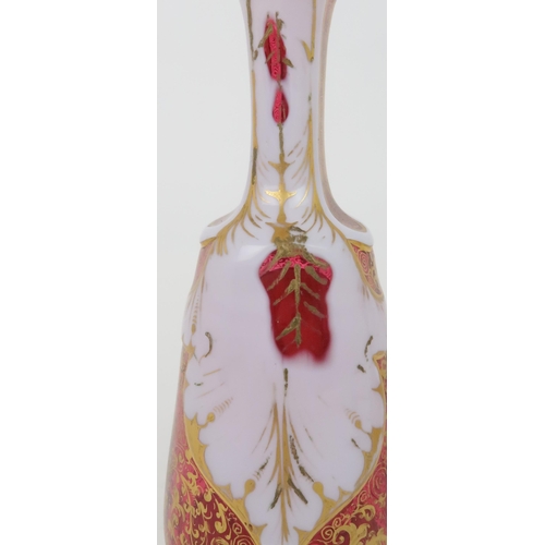 208 - A BOHEMIAN GLASS VASEthe cranberry body overlaid with white glass and cut back with a roundel, paint... 