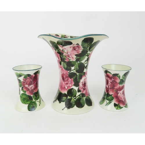 211 - A WEMYSS LADY EVA VASEdecorated with cabbage roses, 20cm high, a pair of waisted cabbage ware vases ... 