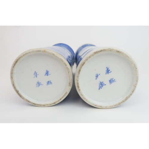 309 - A PAIR OF CHINESE BLUE AND WHITE SPILL VASESpainted with blossoming branches on a blue wash ground, ... 