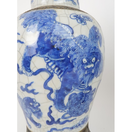 311 - TWO CHINESE BLUE AND WHITE CRACKLEWARE ARCHAIC STYLE VASESone painted with buddhistic lions and clou... 