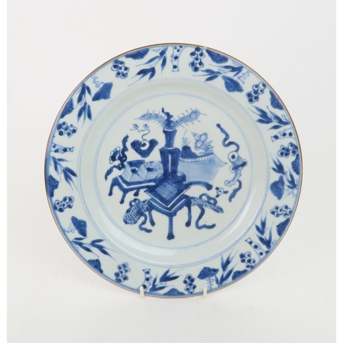 323 - A CHINESE BLUE AND WHITE DISHpainted with precious objects, within a foliate band, 27.5cm diameter, ... 