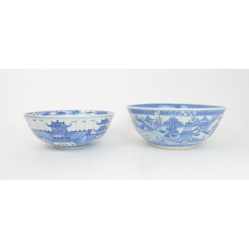 324 - A CHINESE BLUE AND WHITE PUNCH BOWL painted pagodas on islands, 30cm diameter and another paint... 