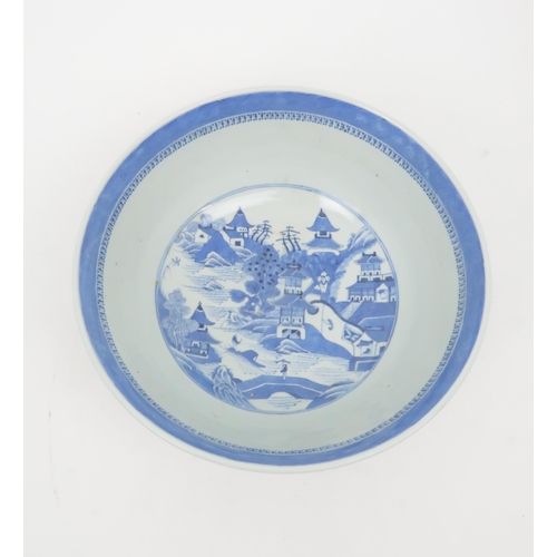 324 - A CHINESE BLUE AND WHITE PUNCH BOWL painted pagodas on islands, 30cm diameter and another paint... 