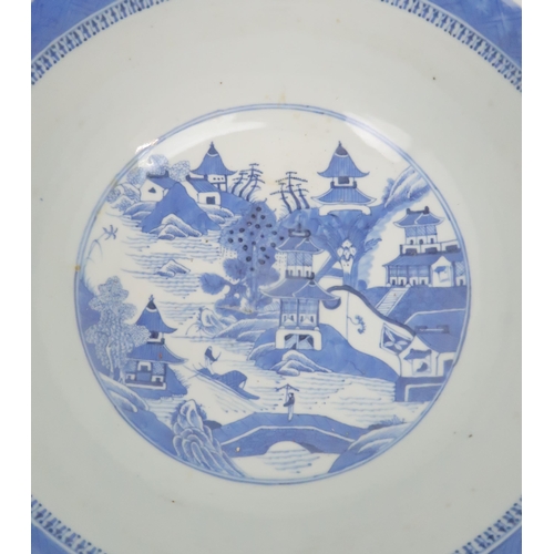 324 - A CHINESE BLUE AND WHITE PUNCH BOWL painted pagodas on islands, 30cm diameter and another paint... 