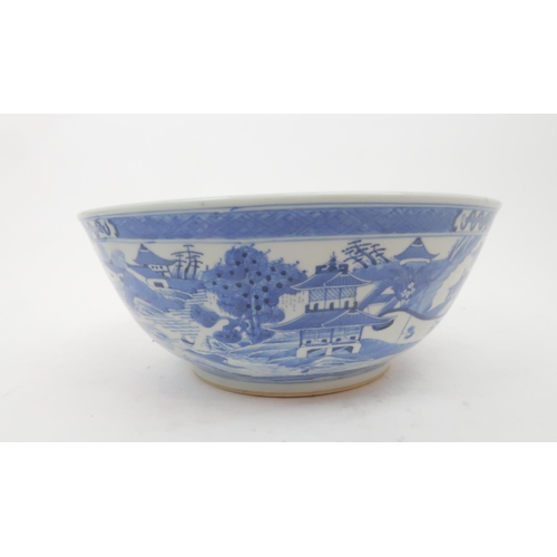 324 - A CHINESE BLUE AND WHITE PUNCH BOWL painted pagodas on islands, 30cm diameter and another paint... 