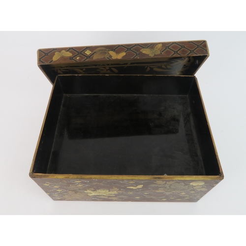 329 -  A JAPANESE GOLD LACQUERED BOXwith shaped cover and base drawer,decorated with birds, butterfli... 