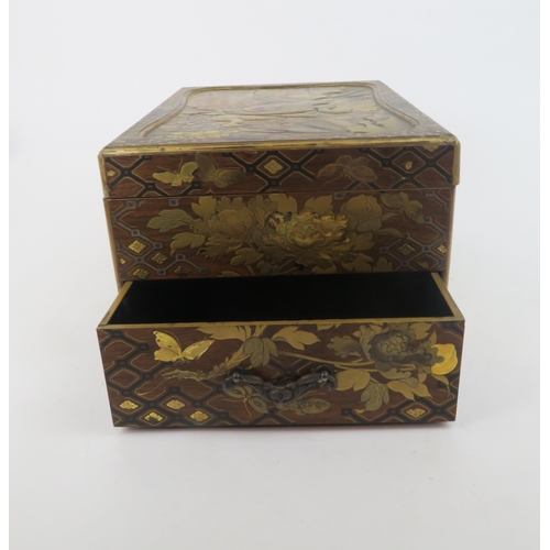 329 -  A JAPANESE GOLD LACQUERED BOXwith shaped cover and base drawer,decorated with birds, butterfli... 