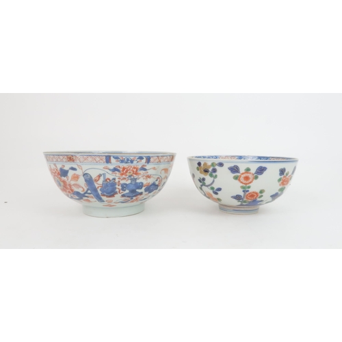 335 - A CHINESE IMARI TEAPOT AND COVERpainted with foliage, 23cm wide, two bowls, 19 and 23cm diameter, tr... 