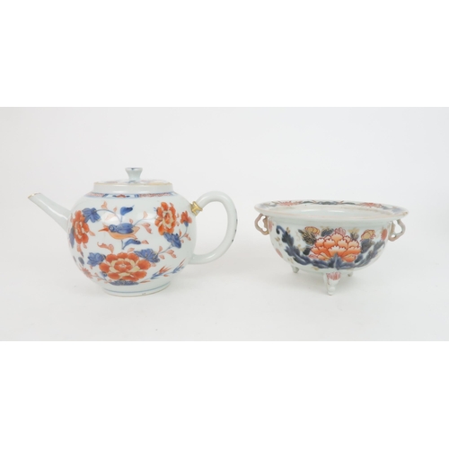 335 - A CHINESE IMARI TEAPOT AND COVERpainted with foliage, 23cm wide, two bowls, 19 and 23cm diameter, tr... 