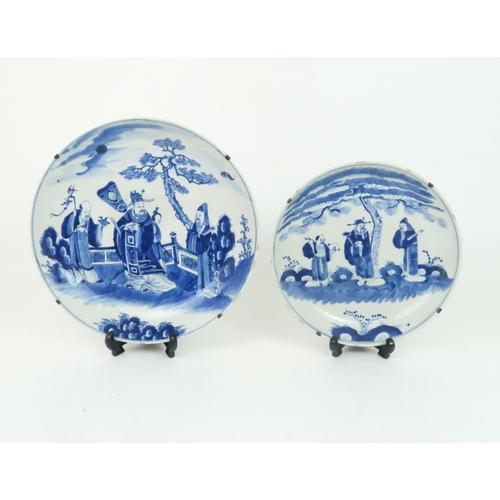 339 - A CHINESE BLUE AND WHITE DISHpainted with a mandarin, sage and officials in a garden and beneath a p... 