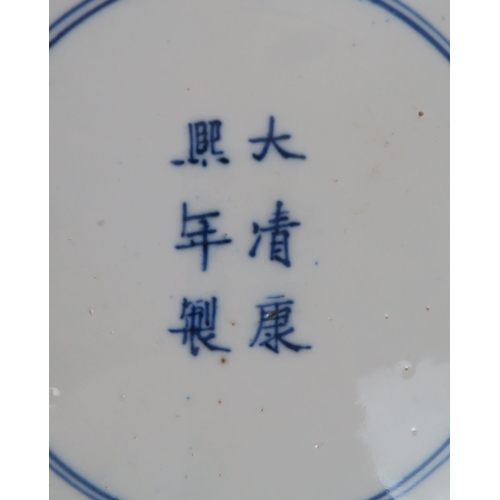 339 - A CHINESE BLUE AND WHITE DISHpainted with a mandarin, sage and officials in a garden and beneath a p... 