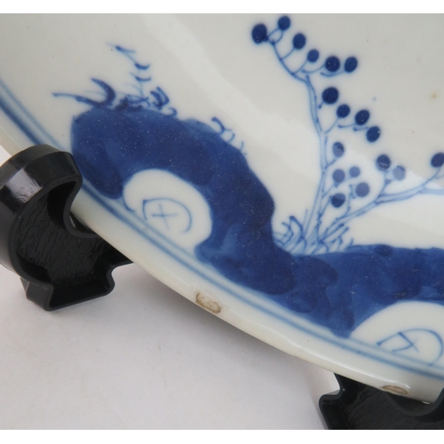 339 - A CHINESE BLUE AND WHITE DISHpainted with a mandarin, sage and officials in a garden and beneath a p... 