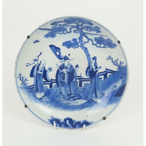 340 - TWO CHINESE BLUE AND WHITE DISHESpainted with a mandarin, sage and officials in a garden and beneath... 