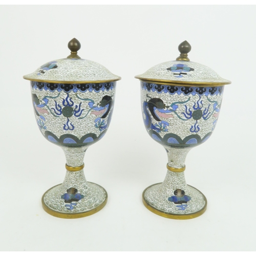 343 - A PAIR OF CHINESE CLOISONNE VASES AND COVERSdecorated with dragons amongst cloud scrolls, 22.5cm hig... 