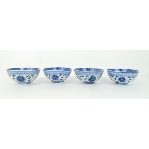 344 - A GROUP OF CHINESE BLUE AND WHITE CERAMICScomprising; four rice bowls painted with peonies and meand... 