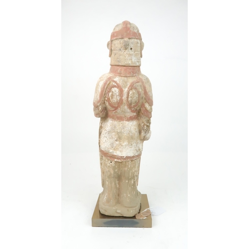 350 - A PAINTED POTTERY MODEL OF A SOLDIERmodelled standing to attention, with a fierce expression, holdin... 