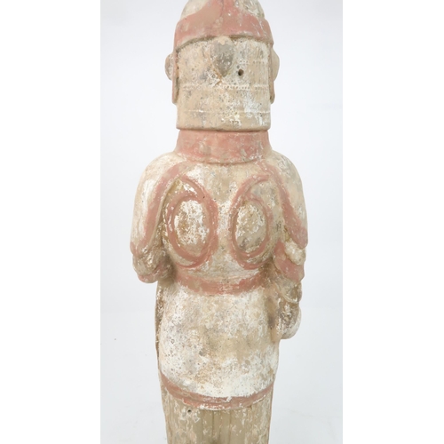 350 - A PAINTED POTTERY MODEL OF A SOLDIERmodelled standing to attention, with a fierce expression, holdin... 