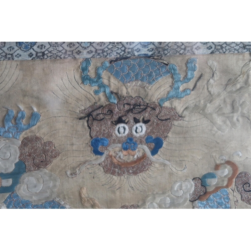 352 - A COLLECTION OF CHINESE SILK EMBROIDERIESincluding an apricot ground panel / section of a robe, embr... 