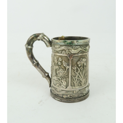 363 - A CHINESE SILVER CHRISTENING MUGcast with panels of figures and plants, faux bamboo handle, stamped,... 