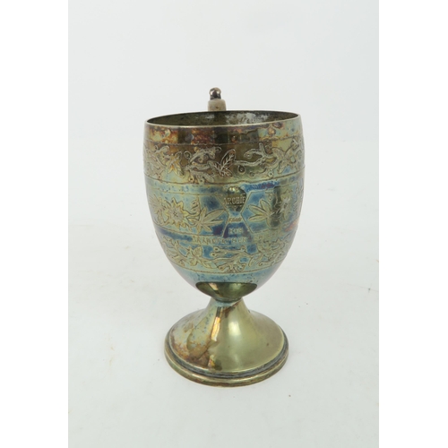 364 - A CHINESE WHITE METAL CHRISTENING MUGdecorated with inscription and amongst bands of foliage,11cm hi... 