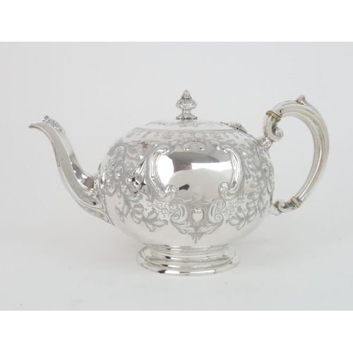 403 - A VICTORIAN SILVER BACHELORS TEA SERVICEthe teapot of bullet form, with ivory insulators, the set wi... 