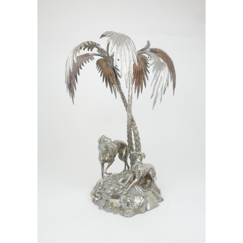 404 - A VICTORIAN SILVER PLATED CENTREPIECEmodelled as a pair of greyhounds on a grassy outcrop with two e... 