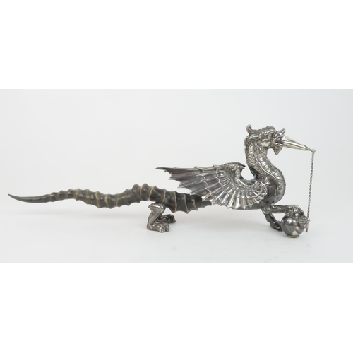 406 - A VICTORIAN SILVER PLATED AND ANTELOPE HORN TABLE LIGHTERin the form of a winged dragon resting its ... 