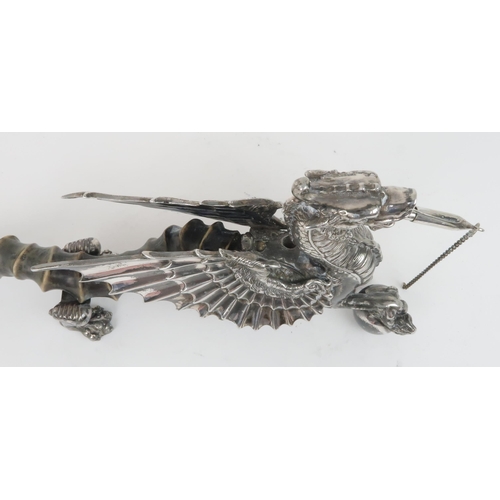 406 - A VICTORIAN SILVER PLATED AND ANTELOPE HORN TABLE LIGHTERin the form of a winged dragon resting its ... 