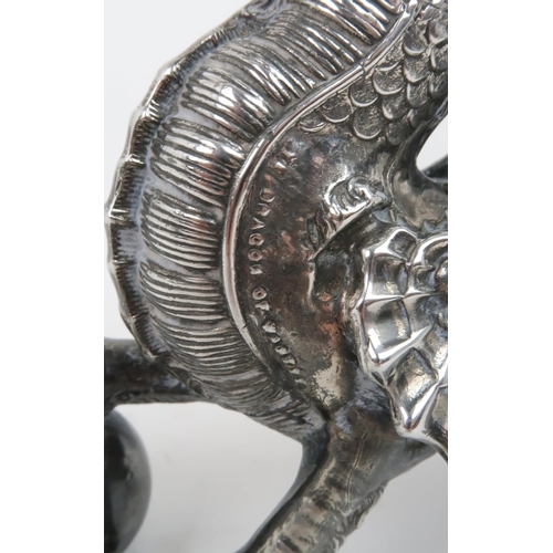 406 - A VICTORIAN SILVER PLATED AND ANTELOPE HORN TABLE LIGHTERin the form of a winged dragon resting its ... 