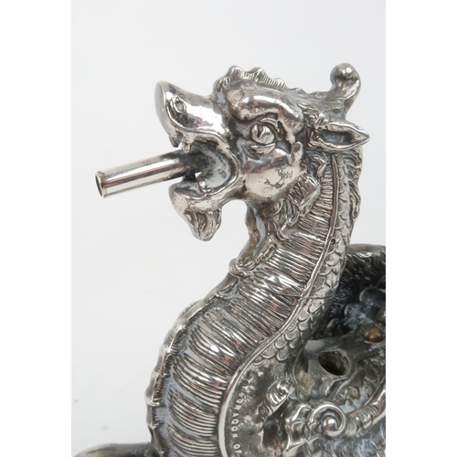 406 - A VICTORIAN SILVER PLATED AND ANTELOPE HORN TABLE LIGHTERin the form of a winged dragon resting its ... 