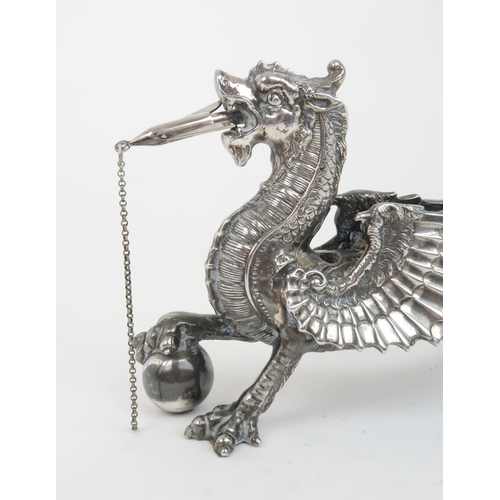 406 - A VICTORIAN SILVER PLATED AND ANTELOPE HORN TABLE LIGHTERin the form of a winged dragon resting its ... 