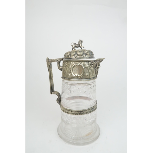 408 - A VICTORIAN SILVER PLATED AND CUT GLASS CLARET JUGthe hinged cover with embossed decoration of fruit... 