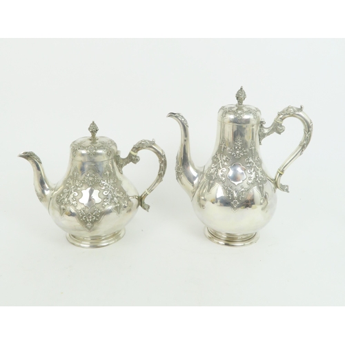 414 - A MATCHED VICTORIAN SILVER FOUR PIECE TEA SERVICEof baluster form, the bodies decorated with gothic ... 