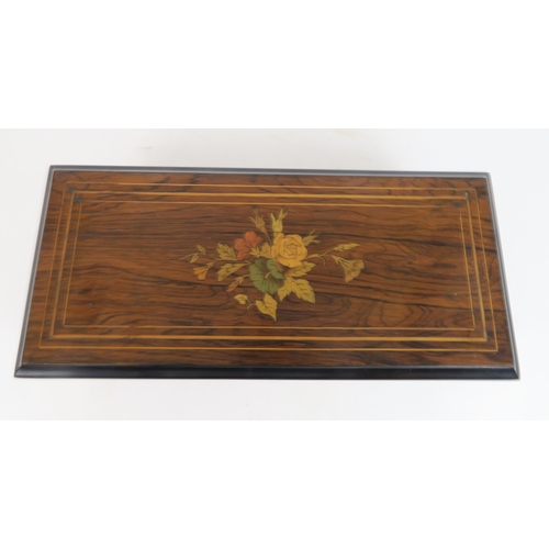 506 - A CONTINENTAL MUSICAL BOXthe rosewood veneered marquetry case enclosing a glazed cover above the mov... 