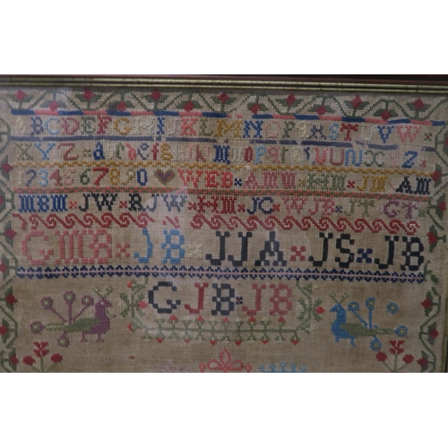 508 - A VICTORIAN SAMPLER 1853woven in coloured wools, by Mary Brown, with country house, animals, trees, ... 