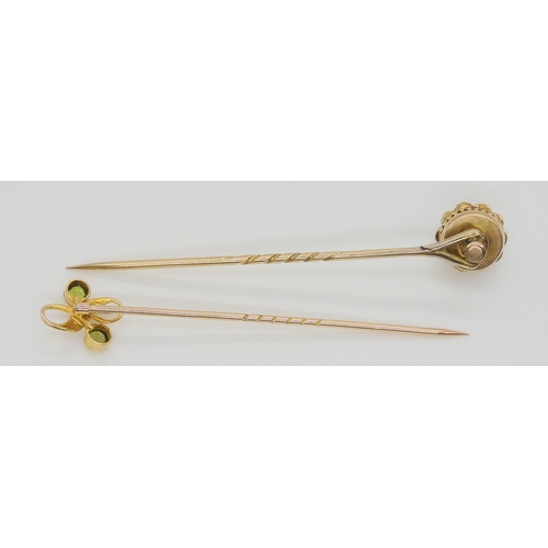 584 - A bright yellow metal peridot and pearl stick pin, together with a yellow metal opal and pearl pin, ... 