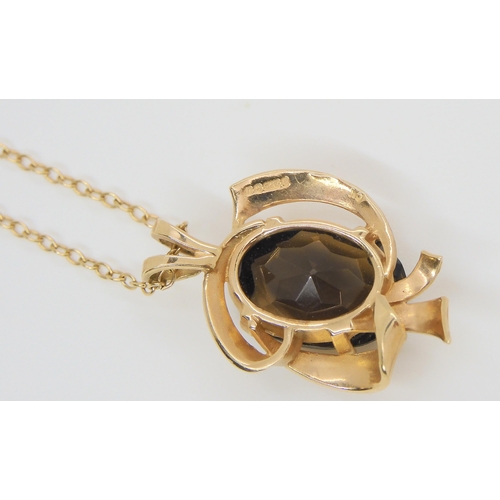 588 - A 9ct gold smokey quartz pendant and chain, wedding ring size V, and two pendants, weight combined 7... 