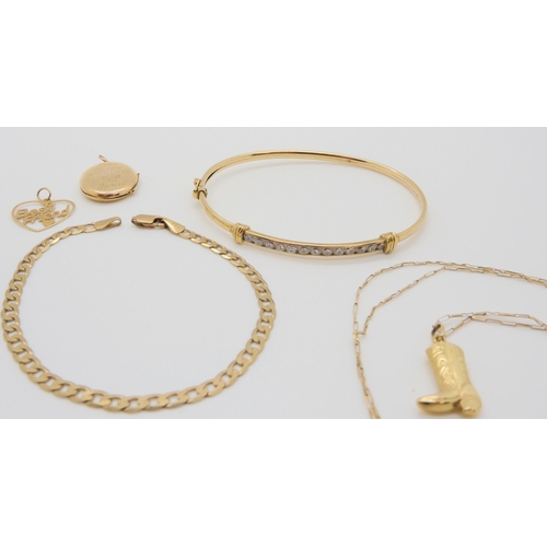 596 - A collection of 9ct gold and yellow metal items to include a bangle, four pendants, chains 9ct back ... 