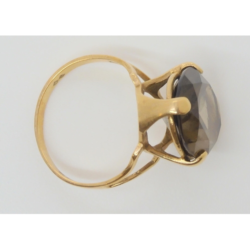 610 - A 9ct gold smokey quartz ring size L, weight 3.4gms