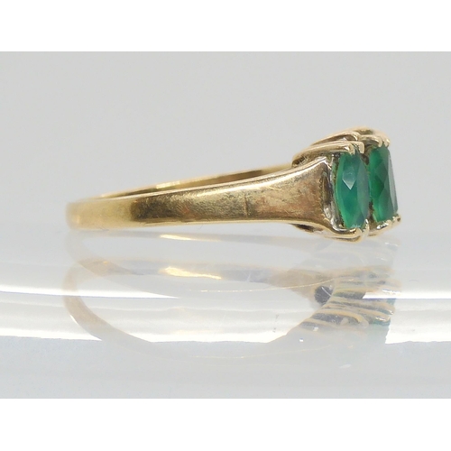 627 - A 9ct gold emerald  and diamond dress ring size N, weight 2.6gms