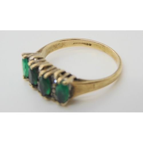 627 - A 9ct gold emerald  and diamond dress ring size N, weight 2.6gms