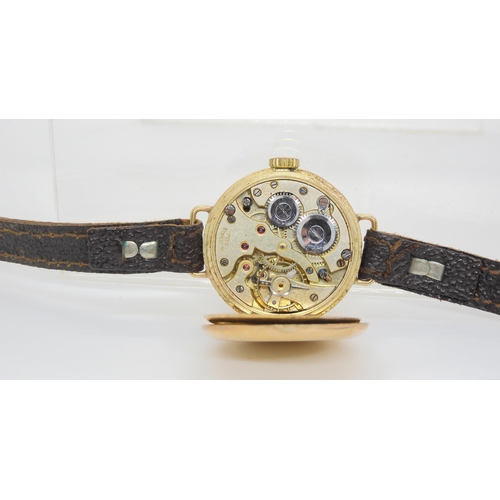 649 - A vintage 9ct gold cased watch with leather strap together with two other 9ct gold watch heads with ... 