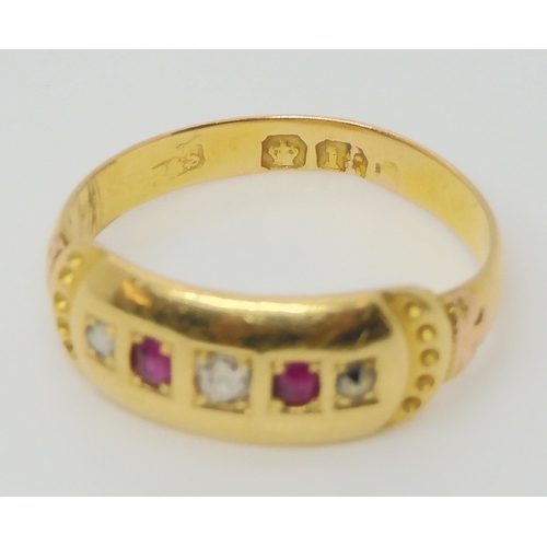 650 - An 18ct gold red gem and diamond ring, size L1/2, weight 3.1gms