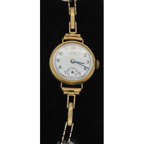 655 - A 9ct gold Record watch and strap, weight including mechanism 19.2gms, together with a further 9ct g... 