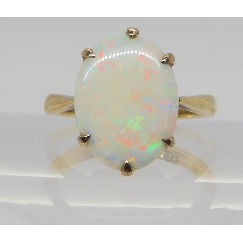 658 - A 9ct gold white opal ring, size L1/2, weight 3.3gms