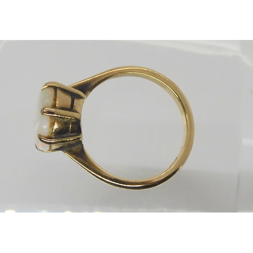 658 - A 9ct gold white opal ring, size L1/2, weight 3.3gms