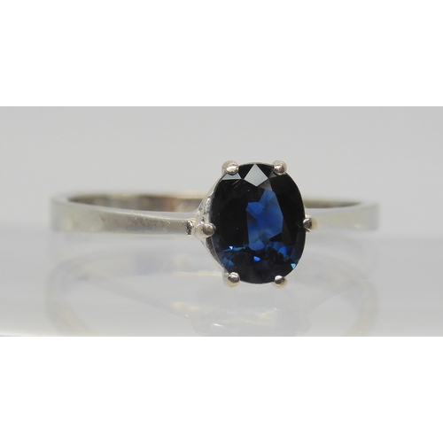 665 - An 18ct gold white gold sapphire ring, sapphire approx 6.5mm x 5.2mm x 3mm, size Q1/2, weight 2.4gms