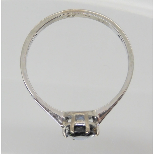 665 - An 18ct gold white gold sapphire ring, sapphire approx 6.5mm x 5.2mm x 3mm, size Q1/2, weight 2.4gms