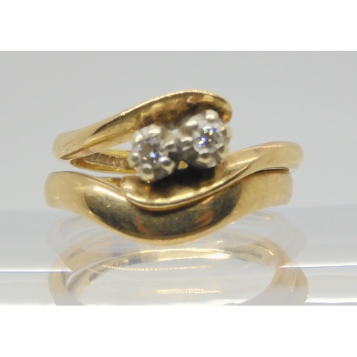 667 - A 9ct gold twin stone  diamond ring, set with estimated approx 0.10cts of brilliant cut diamond... 